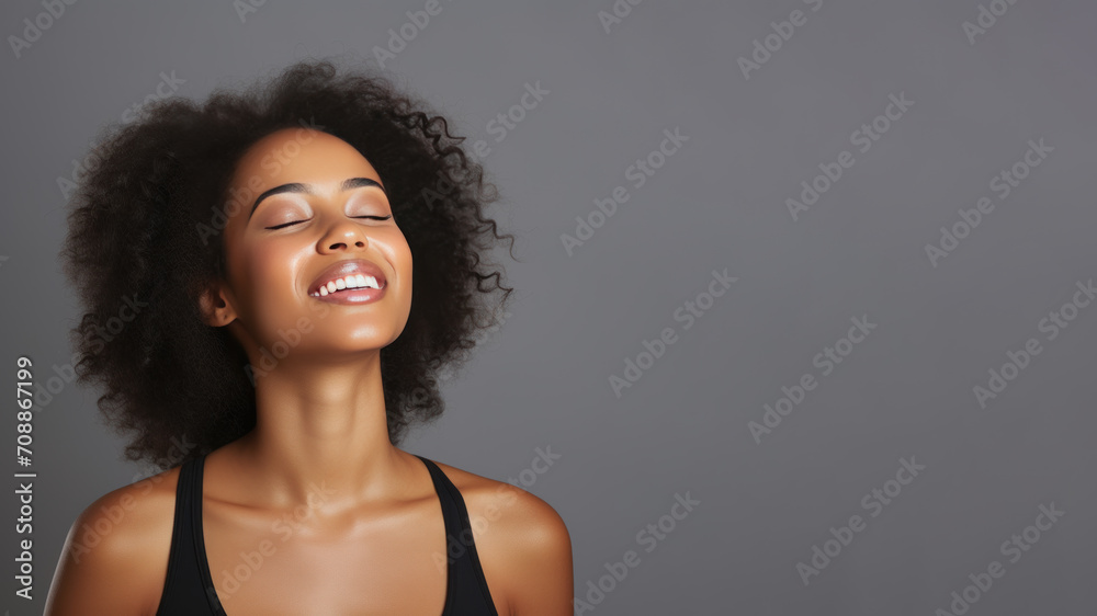 A African woman breathing calmly looking up isolated on gray background - obrazy, fototapety, plakaty 