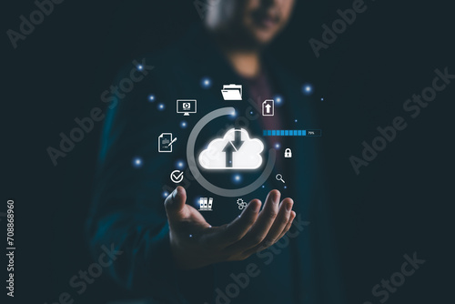 Businessman showing virtual glowing cloud computing to download and loading data information and upload on system network application. Data transfer. Technology data transformation concept. photo