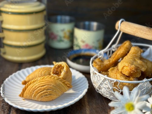 Curry Puffs Epok-Epok or Karipap Pusing - Deep Fried Malaysian, Singaporean, and Thai snack filled with curried meat and or vegetables. photo