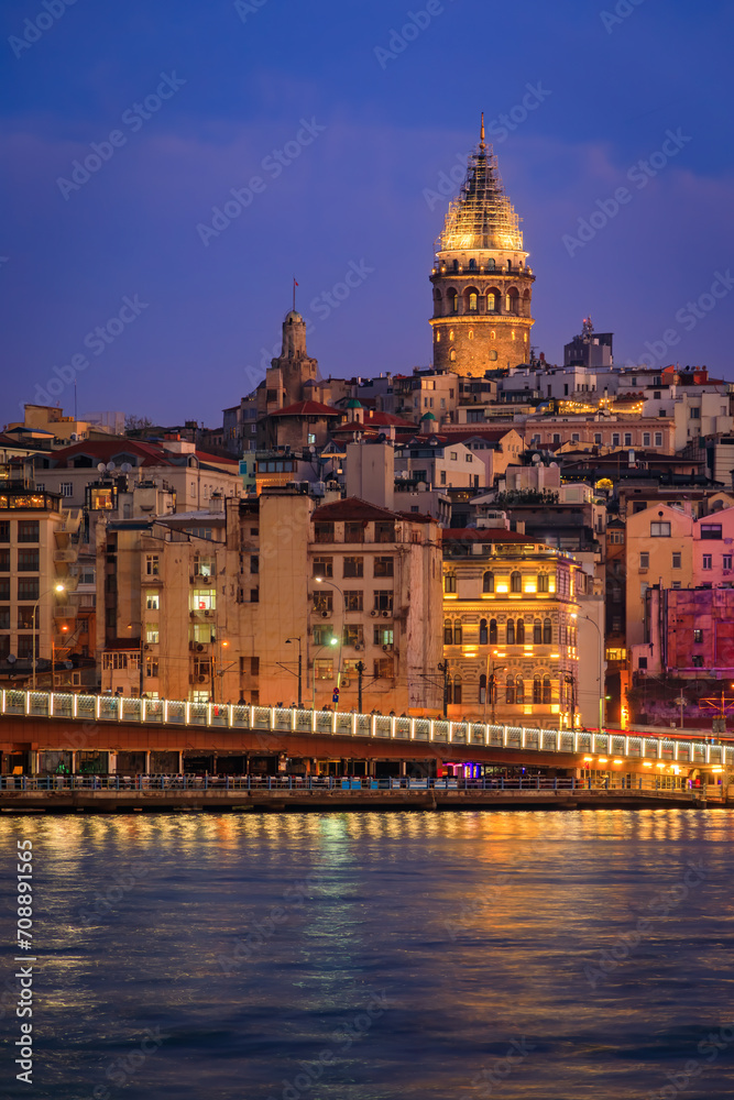 Sunrise cityscape of the Karakoy area across the Bosphorus Strait near Galata Bridge with the Galata Tower at the blue hour in Istanbul, Turkey