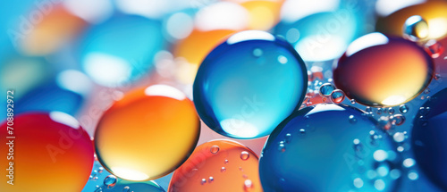 Vibrant, macro shot of colorful gel dots against a blue backdrop.