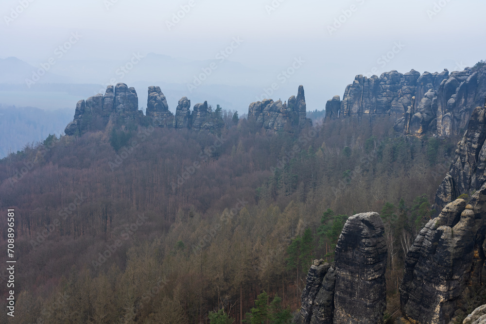 An early morning in mountain. Schrammsteine - group of rocks are a long, strung-out, very jagged in the Elbe Sandstone Mountains located in Saxon Switzerland in East Germany.