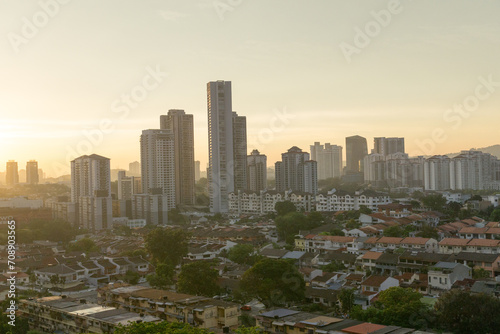 Fotografija condos towering over terrace houses at sunset