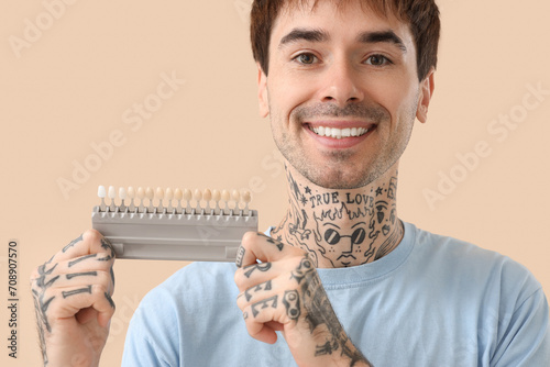 Young tattooed man with tee...