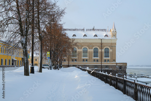 The building of the New Grain Exchange and the Volga embankment on a January day. Rybinsk, Yaroslavl region. Russia