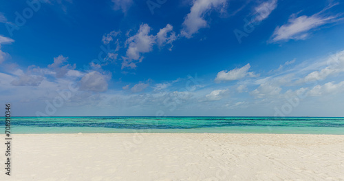 Tranquil seascape. Relaxing sunny beach empty summer vacation holiday beachfront. Waves surf with amazing blue ocean lagoon, sea shore, coastline. Beautiful bright beach, seaside copy space text ready
