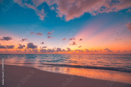 Closeup sea sand beach. Peaceful beach landscape. Inspire tropical beachfront seascape horizon. Orange purple golden sunset sky calmness tranquil relaxing sunlight summer mood. Vacation travel coast © icemanphotos