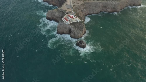Aerial video of the lighthouse and cliffs at Cape St. Vincent. The sea view of the Algarve