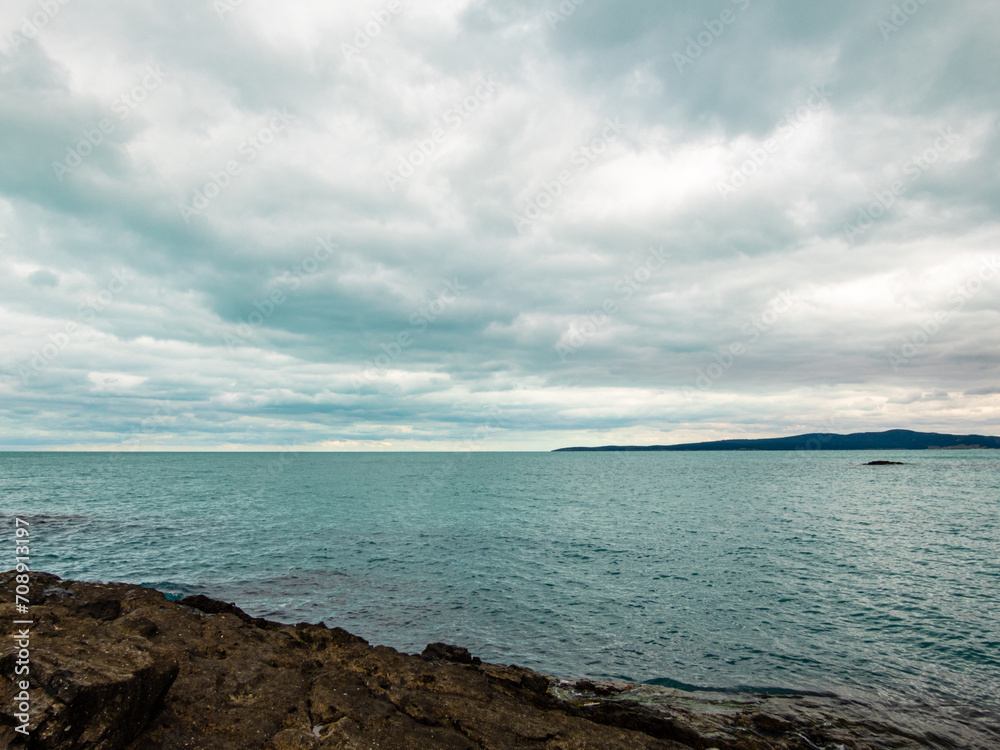 Landscape with sea and cloudy dramatic sky