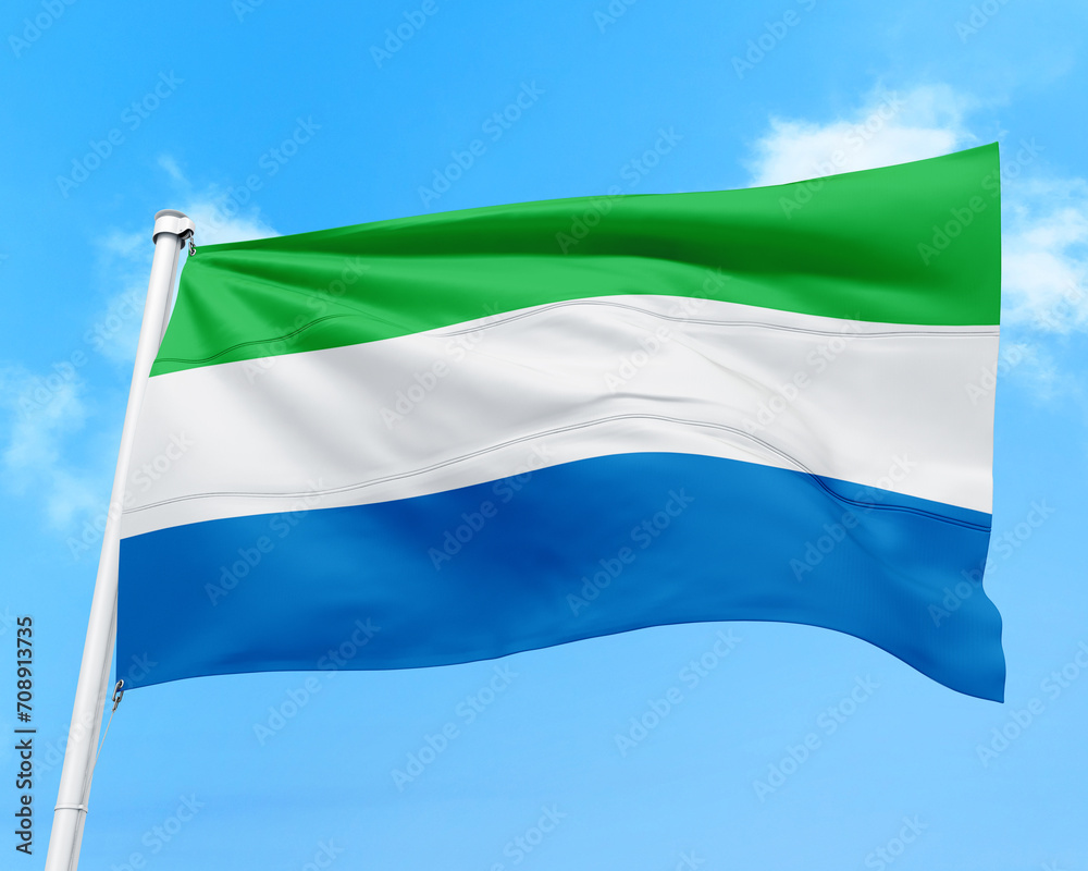 Fototapeta premium Sierra Leone flag fluttering in the wind on sky.