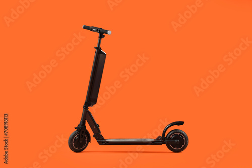 Black modern electric kick scooter on orange background