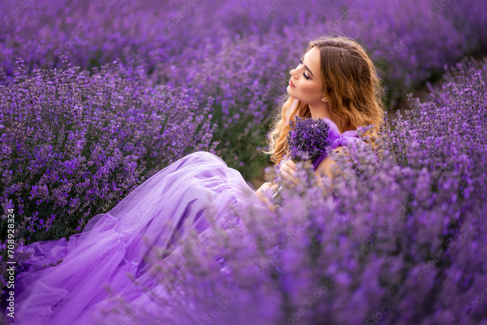 Portrait of a beautiful young woman with a bouquet of lavender in a field with purple flowers Portrait of a beautiful young woman with a bouquet of lavender in a field with purple flowers
