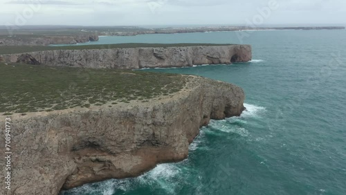 Aerial video of the lighthouse and cliffs at Cape St. Vincent. The sea view of the Algarve