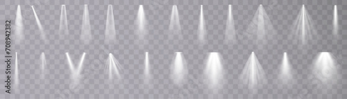 Set of isolated spotlight light effects. White glowing spotlight on a transparent background.
