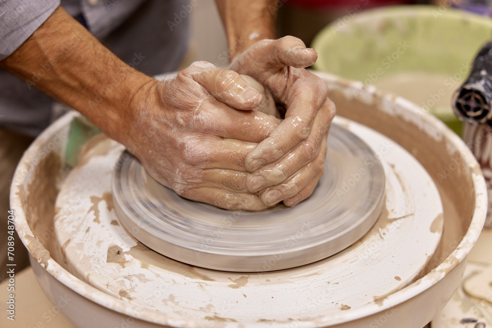 man making a cup from clay pot on pottery wheel, Close-up