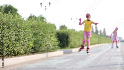 Wallpaper Mural Girl in elbow pads and knee pads roller-skating on one leg Torontodigital.ca