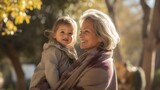 mid age woman, grandmother with grandchild in a park, without make up, emphasizing gray hair and natural aging, 