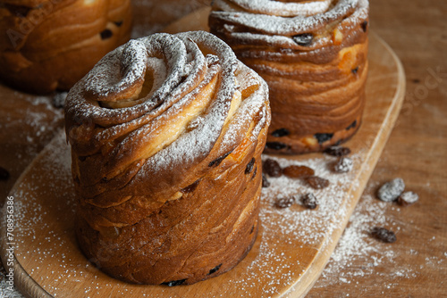 Happy easter. Traditional Easter cake , homemade kraffin with raisins,candied fruits. Selective focus. Close up of homemade Cruffin. photo