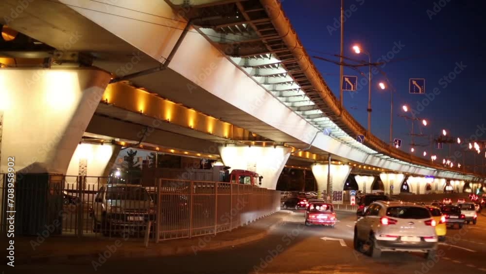 many cars moving at road near overpass at dark night many cars moving at road near overpass at dark night