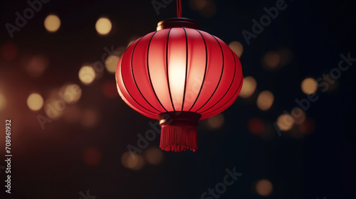 A single red Chinese lantern hanging against a dark background with soft glowing bokeh, symbolizing celebration and culture.