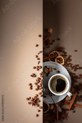 Black coffee with spices on a beige background.