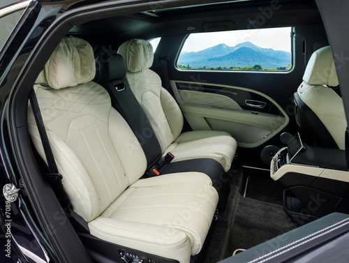 view of the mountains from the interior of a luxury SUV with leather interior. Comfortable shuttle transfer for travel and business © AvokadoStudio