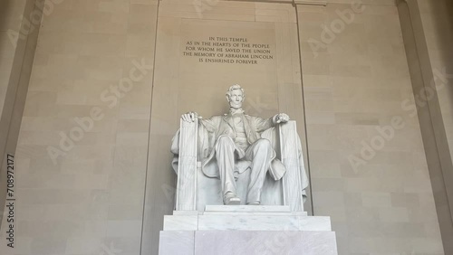 The monument and statue of Abraham Lincoln sitting in a chair at the National Mall Memorial in Washington DC (USA).