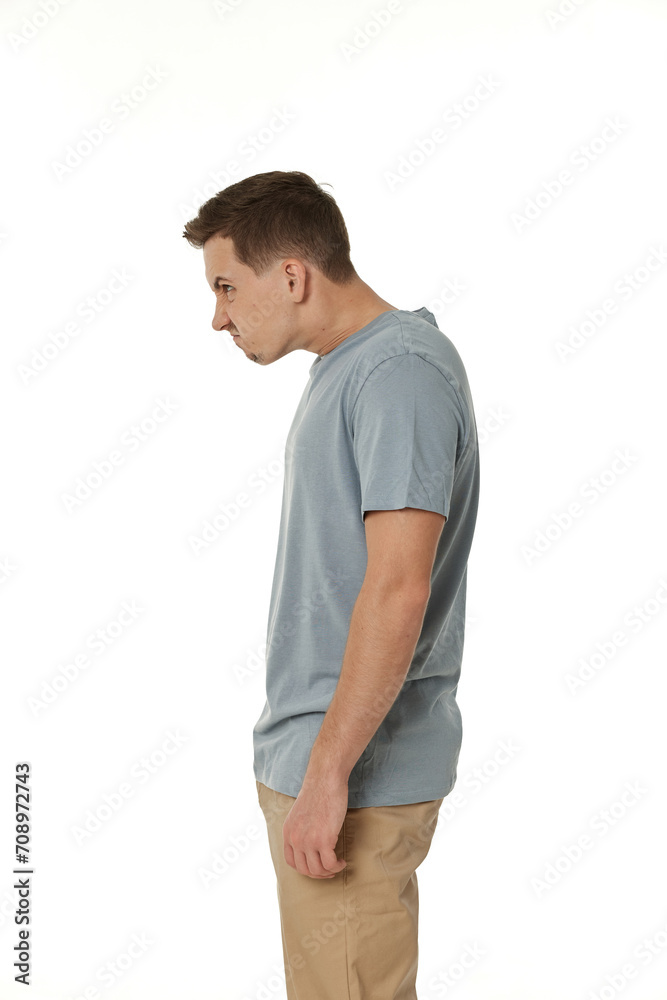 Fototapeta premium annoyed angry man standing on white studio background