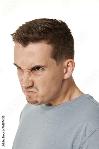 annoyed angry man shouting on white studio background
