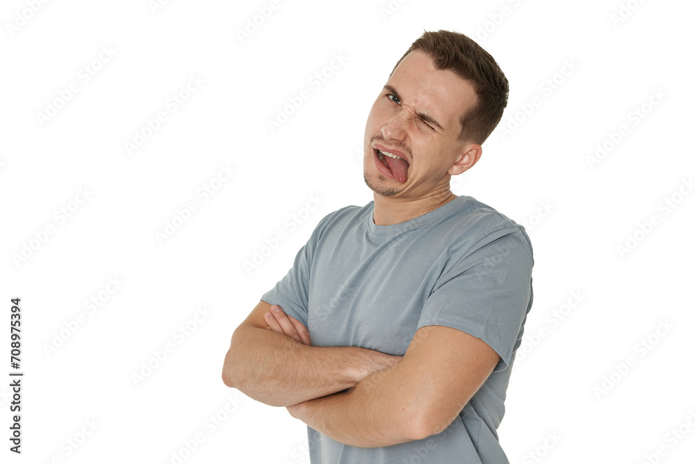 Obraz premium young man shows her toung, feels disgust on white background.
