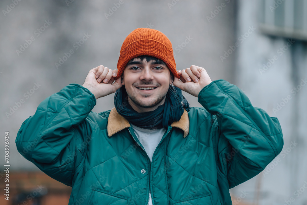 portrait of young man on the street in winter warm and wearing a hat portrait of young man on the street in winter warm and wearing a hat