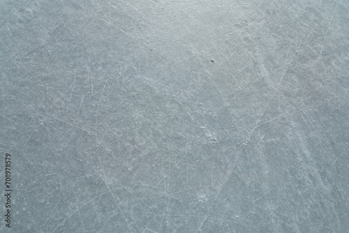 Scratched ice at the ice rink as texture or background for winter composition photo