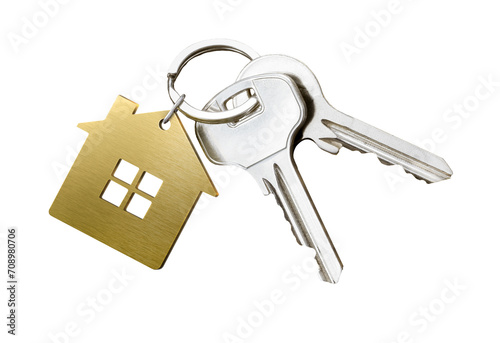 House keys with golden house shaped keychain isolated on white background photo