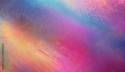 close up of ethereal bright neon pink magenta orange blue purple holographic metallic foil background abstract modern curved blurred surreal futuristic disco rave techno festive backdrop photo
