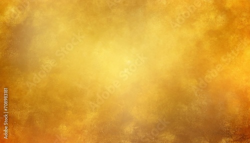 yellow background with soft gold center and orange vintage texture with light blur and autumn colors abstract golden background © Richard