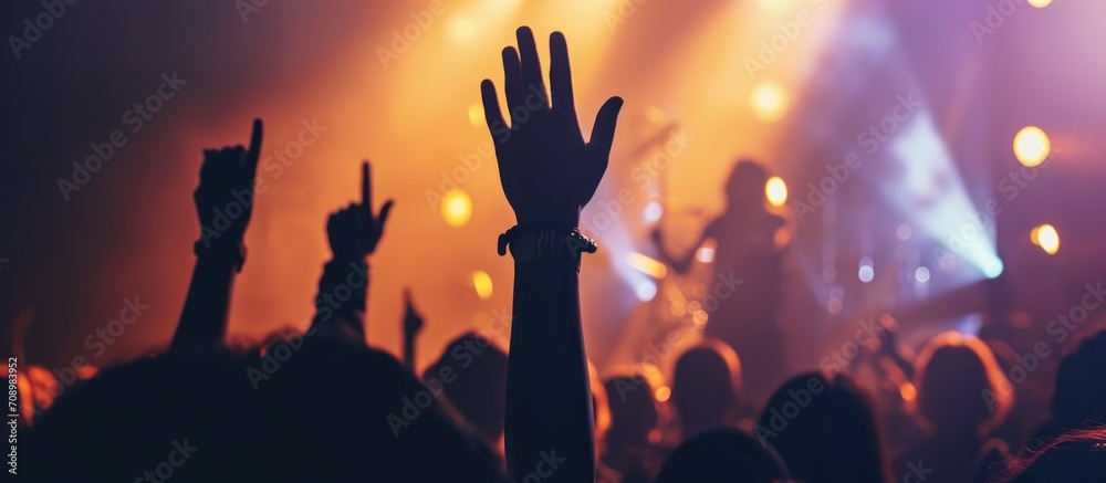 Fototapeta premium Raised hand at Christian music concert.