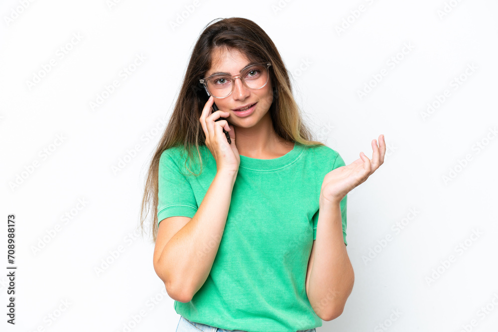 Young caucasian woman isolated on white background keeping a conversation with the mobile phone with someone Young caucasian woman isolated on white background keeping a conversation with the mobile phone with someone