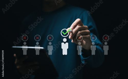 Human resource management concept. HR manager touching to virtual Human resource icons for employee recruitment. Check resume, Screening employee information and job applicants.