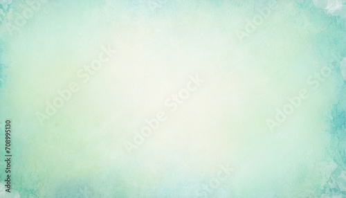 pastel green background paper in texture border design of soft blank solid blue green background with light center and dark borders elegant easter spring color with faint distressed vintage texture