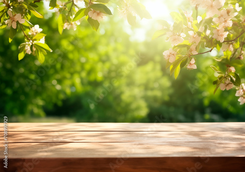 Wooden table in a blooming spring garden