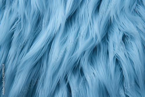 A close up of a blue fur suitable for use in backgrounds, fashion design, textiles, and creative projects requiring a soft and luxurious texture.