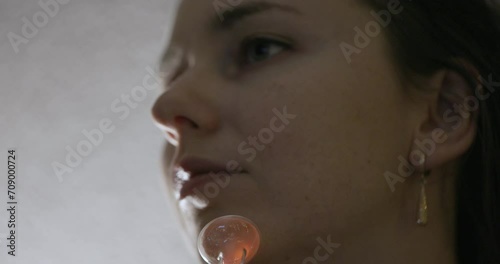 Skin Care. Woman receives a Procedure using the Darsonval device at home. Close-up of the Skin. Concept of professional Cosmetology photo