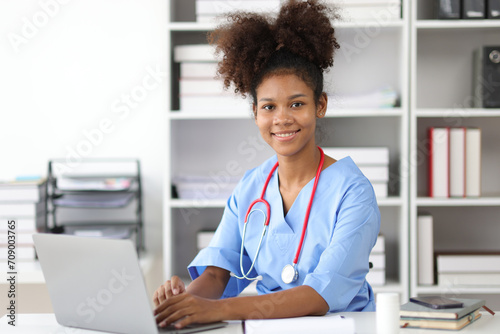 Portrait of an African medical student doing an internship in an office at a hospital.