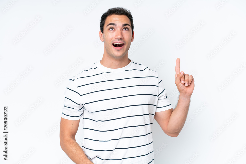 Young caucasian man isolated on white background pointing up and surprised Young caucasian man isolated on white background pointing up and surprised