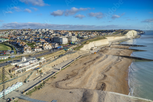 Aerial view of the White Chalk Cliffs at Saltdean in East Sussex heading west towards Peacehaven along the undercliff walk.