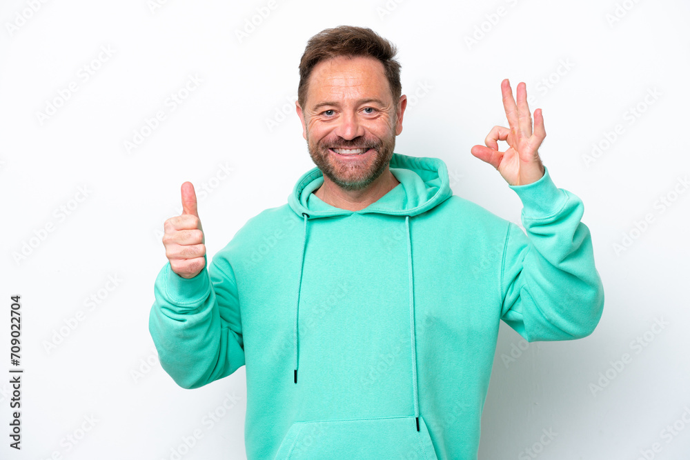 Middle age caucasian man isolated on white background showing ok sign and thumb up gesture Middle age caucasian man isolated on white background showing ok sign and thumb up gesture