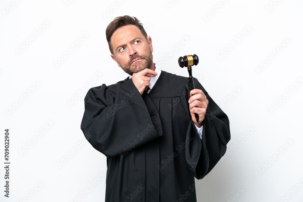 Middle age judge man isolated on white background and looking up Middle age judge man isolated on white background and looking up