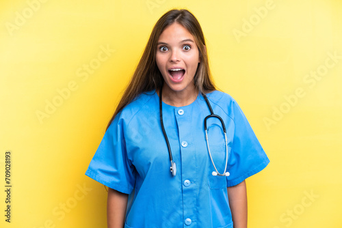 Young nurse caucasian woman isolated on yellow background with surprise facial expression