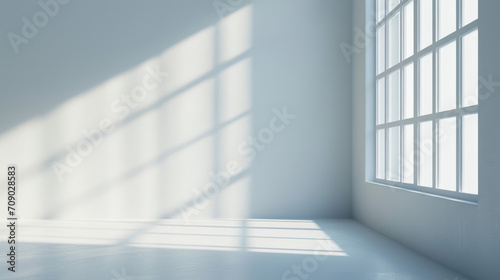 A superflat  light grey background designed for product presentations  featuring soft light and shadow accents from nearby windows.