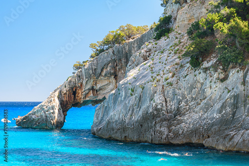 The rocky natural arch of Cala Goloritzè, in the Orosei gulf in east Sardinia photo